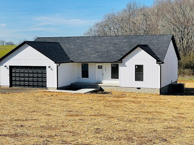 modern farmhouse style home featuring a garage