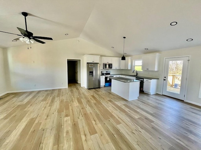 kitchen featuring sink, stainless steel appliances, white cabinets, and light wood-type flooring