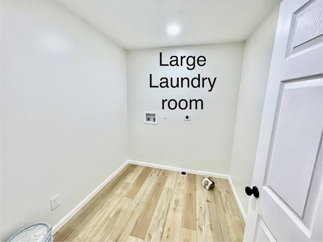 washroom featuring washer hookup, wood-type flooring, and hookup for an electric dryer