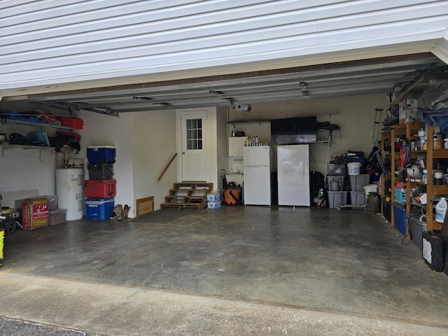 garage with white refrigerator and water heater