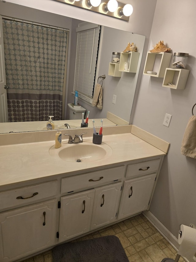 bathroom with vanity, toilet, and a shower with shower curtain