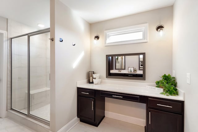 bathroom featuring vanity and an enclosed shower