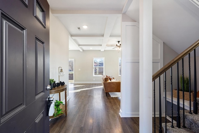 foyer featuring dark wood-type flooring, ceiling fan, coffered ceiling, and beam ceiling