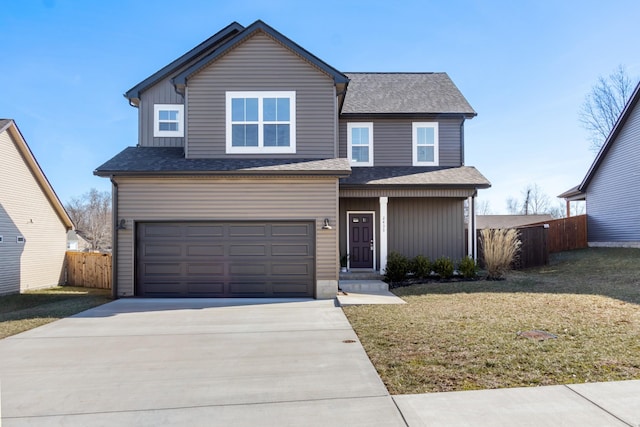 view of property featuring a garage and a front yard