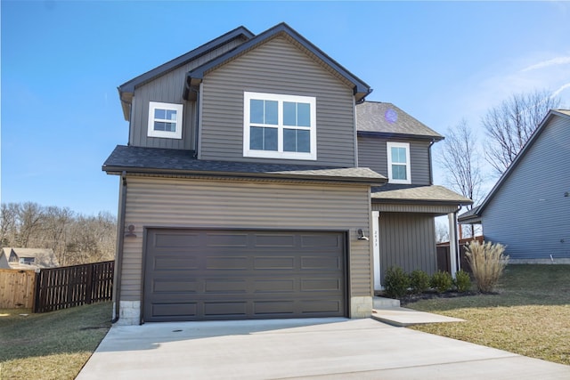 front of property featuring a garage and a front lawn