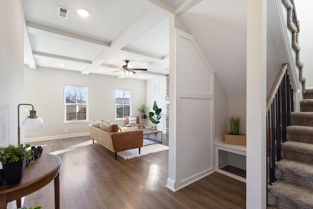 living room featuring coffered ceiling, ceiling fan, dark hardwood / wood-style flooring, and beam ceiling