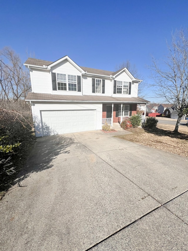 front of property featuring a garage and a porch