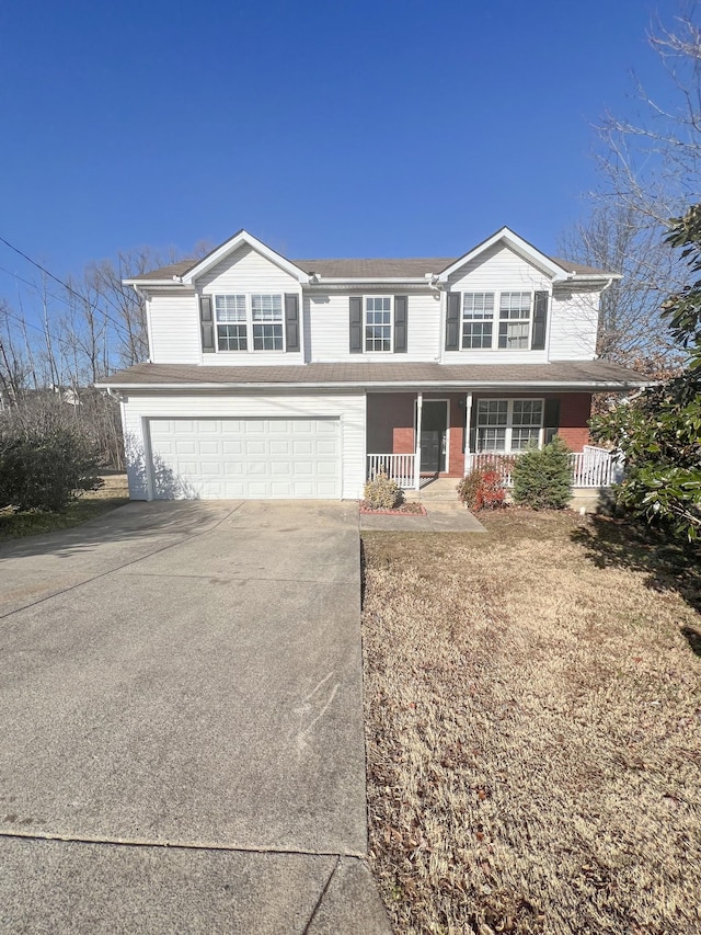 front of property with a porch and a garage