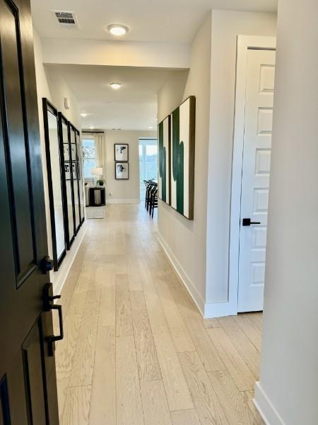 hallway featuring light hardwood / wood-style flooring