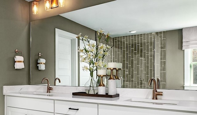 bathroom with vanity and tasteful backsplash