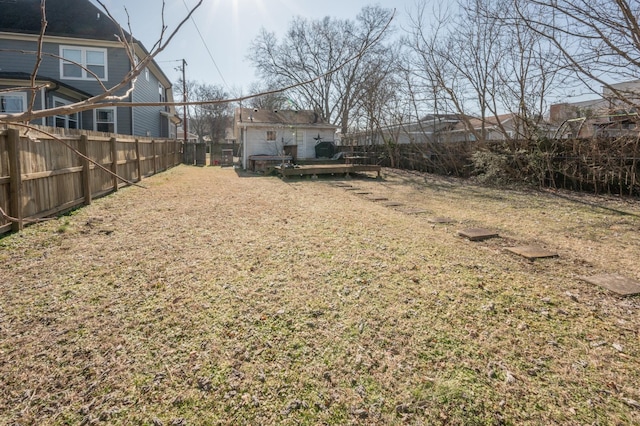 view of yard featuring a wooden deck