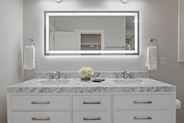 bathroom featuring double vanity and a sink