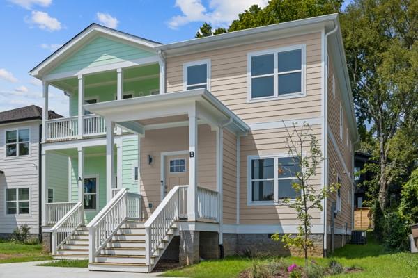 view of front of house featuring central AC unit and a porch