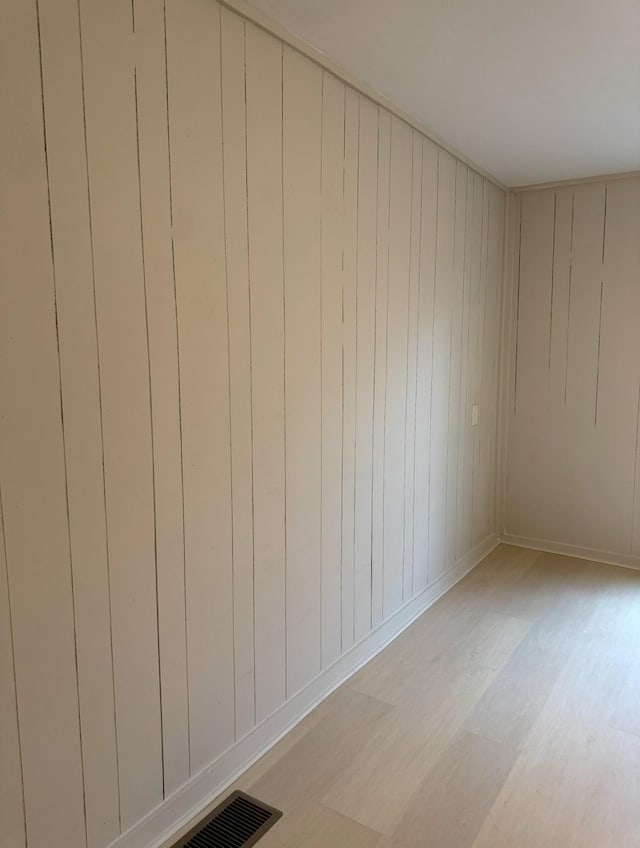 spare room featuring light hardwood / wood-style floors