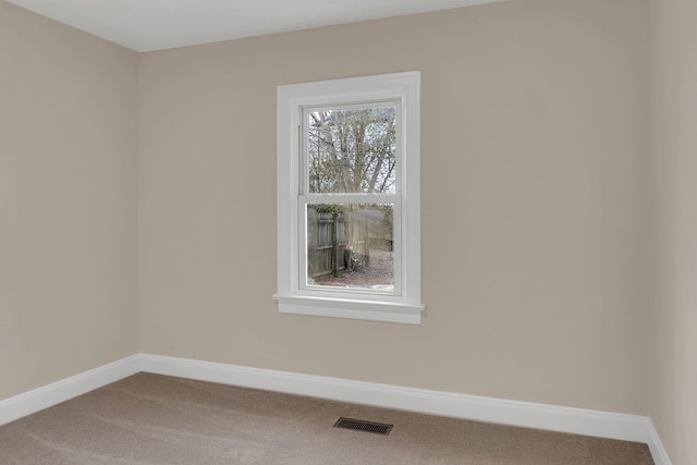 unfurnished room with carpet flooring