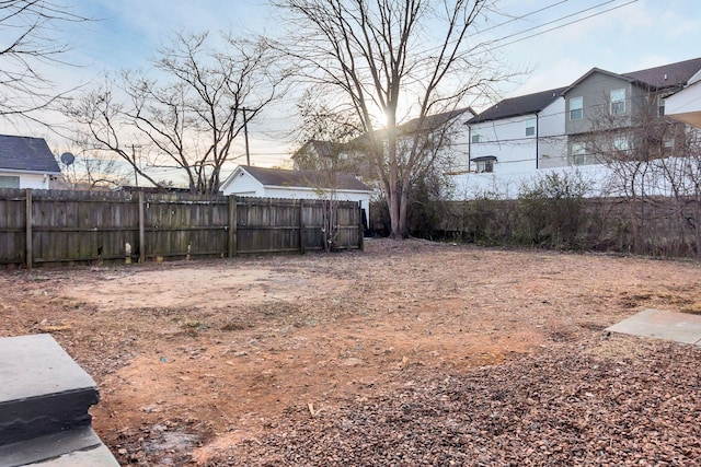 view of yard at dusk