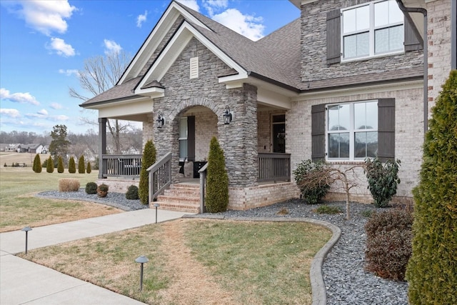 view of front of home featuring a porch and a front yard