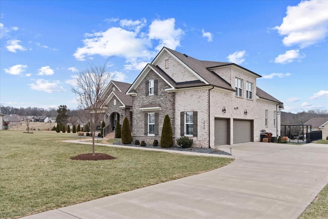 view of front of home featuring a garage and a front yard