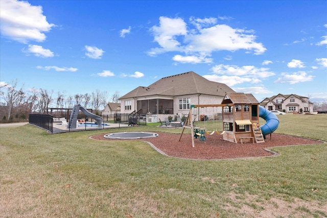 view of playground featuring a yard and a trampoline