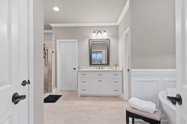 bathroom featuring tiled shower, ornamental molding, and vanity