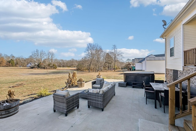 view of patio / terrace with a hot tub