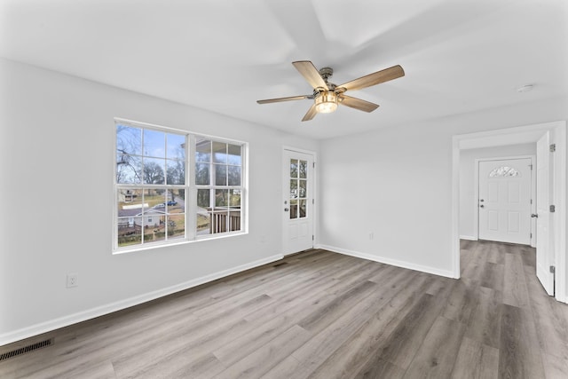 unfurnished room featuring light hardwood / wood-style flooring and ceiling fan