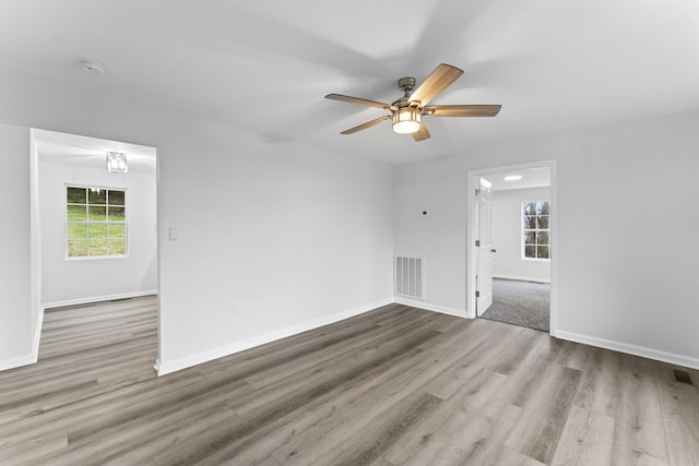 spare room featuring ceiling fan and light wood-type flooring