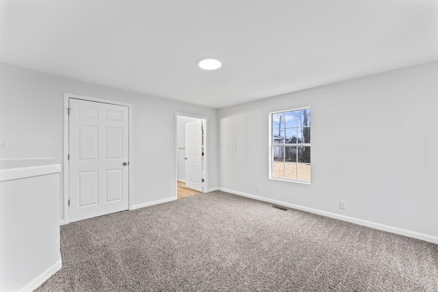 unfurnished bedroom featuring light colored carpet