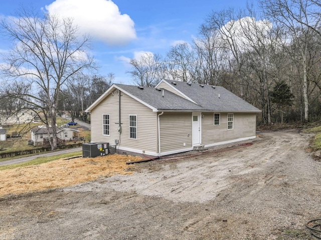 rear view of house with central AC unit