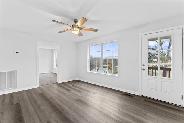 foyer with ceiling fan and dark hardwood / wood-style floors