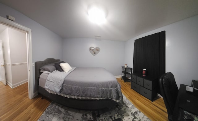 bedroom with wood-type flooring