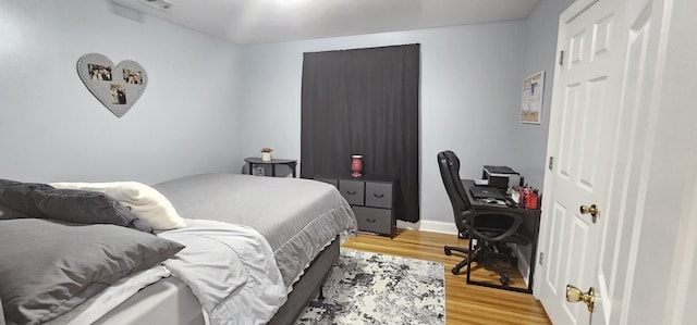 bedroom featuring light hardwood / wood-style floors