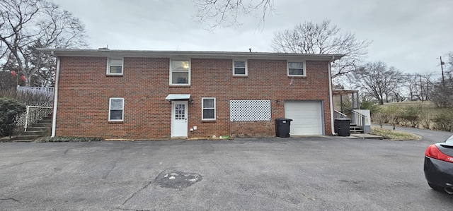 back of house featuring a garage