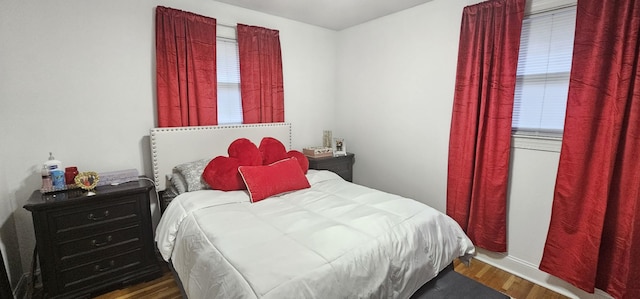 bedroom with hardwood / wood-style floors