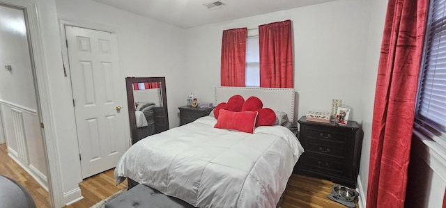 bedroom featuring wood-type flooring