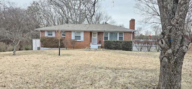 ranch-style home with a front lawn