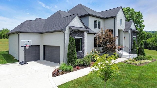 view of front facade featuring a garage and a front yard