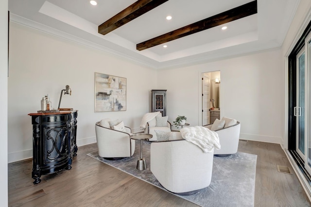 living room featuring hardwood / wood-style floors and beam ceiling