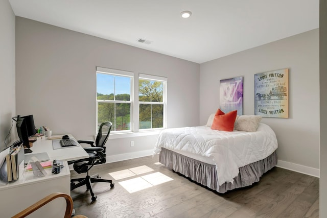 bedroom featuring hardwood / wood-style flooring