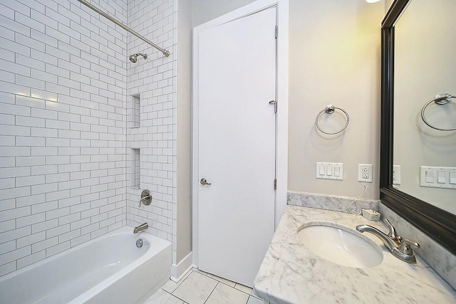 bathroom with vanity, tile patterned floors, and tiled shower / bath