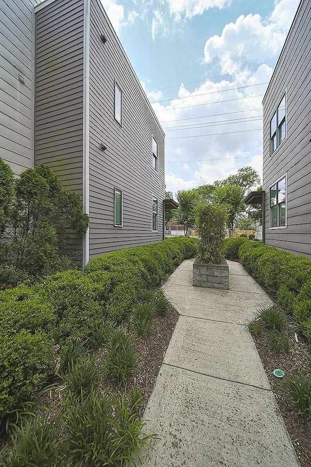 view of side of home with a patio area