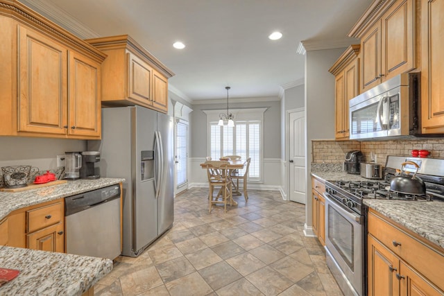 kitchen with pendant lighting, crown molding, stainless steel appliances, light stone countertops, and a chandelier