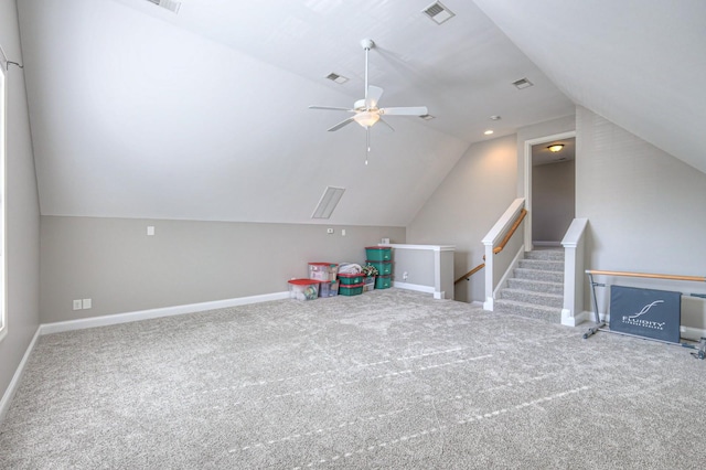 game room with lofted ceiling, ceiling fan, and carpet flooring