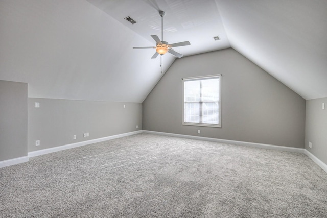 bonus room featuring lofted ceiling, carpet, and ceiling fan