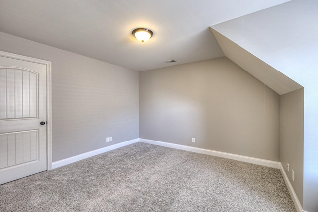 bonus room featuring lofted ceiling and carpet floors