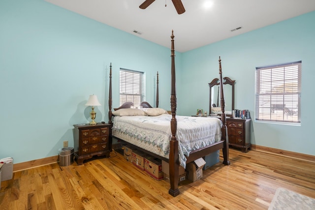 bedroom with ceiling fan and light hardwood / wood-style flooring