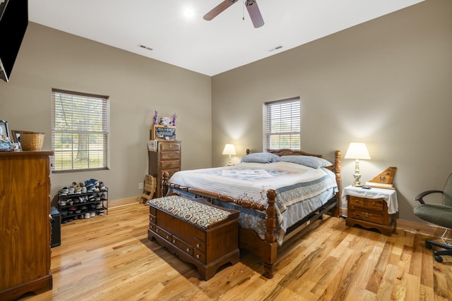 bedroom with ceiling fan and light hardwood / wood-style flooring