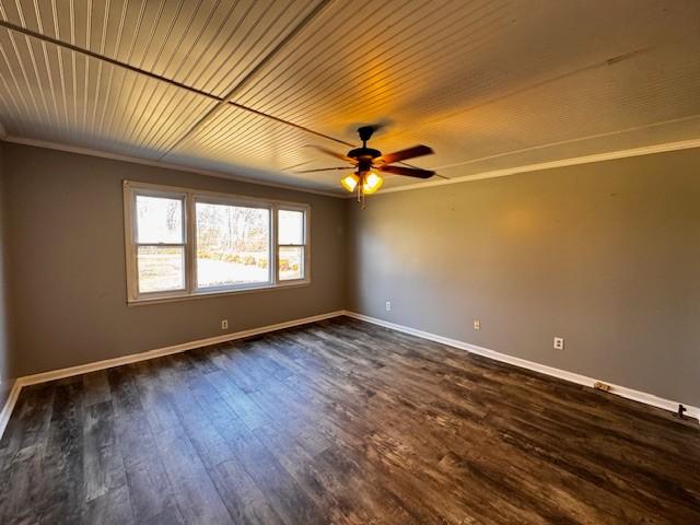 unfurnished room with ceiling fan, ornamental molding, and dark hardwood / wood-style flooring