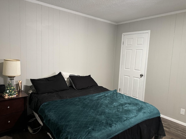 bedroom featuring crown molding, dark hardwood / wood-style floors, a textured ceiling, and wood walls