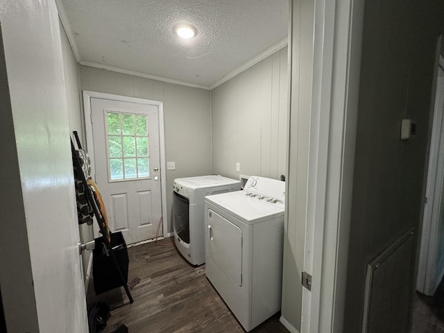 laundry room featuring crown molding, dark hardwood / wood-style floors, separate washer and dryer, and a textured ceiling